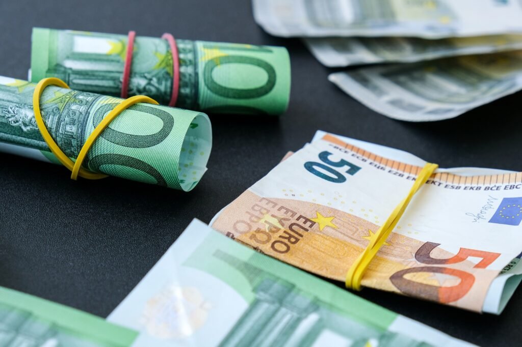 Close up of Euro money roll. Euro banknote set cash money - EU currency. Rolled with rubber euro not